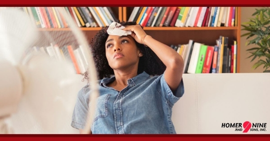 Woman in home with fan